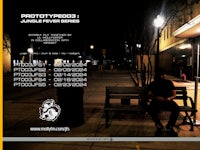 a man sitting on a bench at night